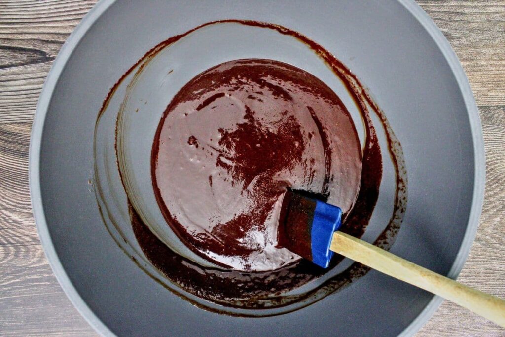 add sugar, red wine, and vanilla to the melted chocolate