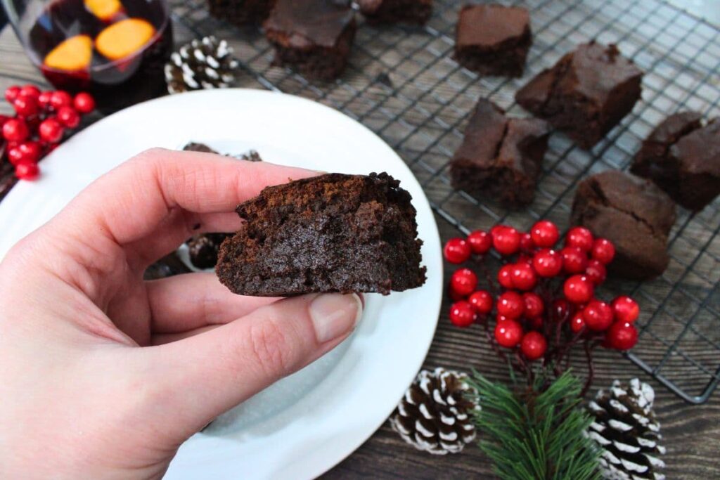 holding up a mulled wine brownie cooked in the air fryer