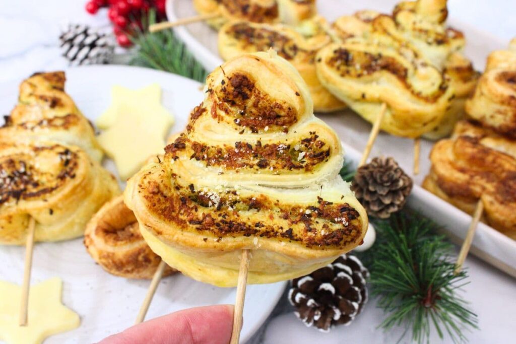 holding up an air fryer mini puff pastry christmas tree