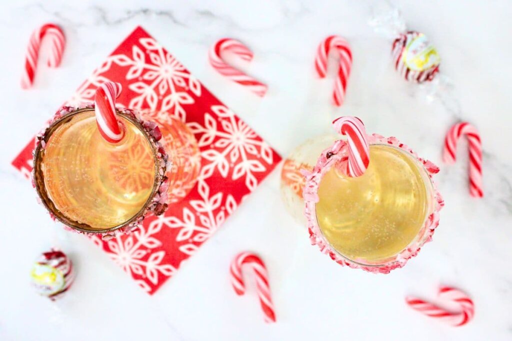overhead view of peppermint bark mimosas surrounded by candy canes
