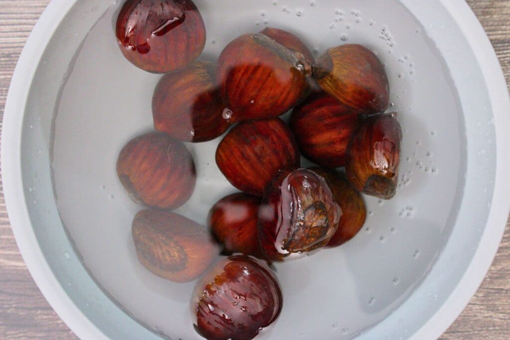 place fresh chestnuts in a bowl of warm water