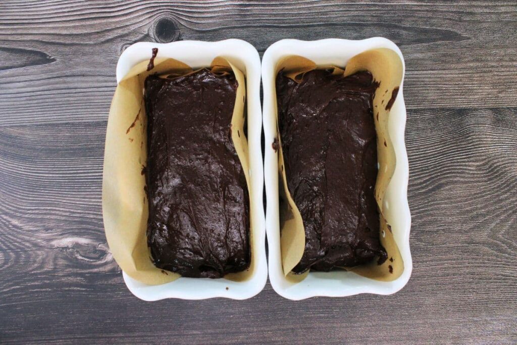 pour wine chocolate batter into greased baking dishes