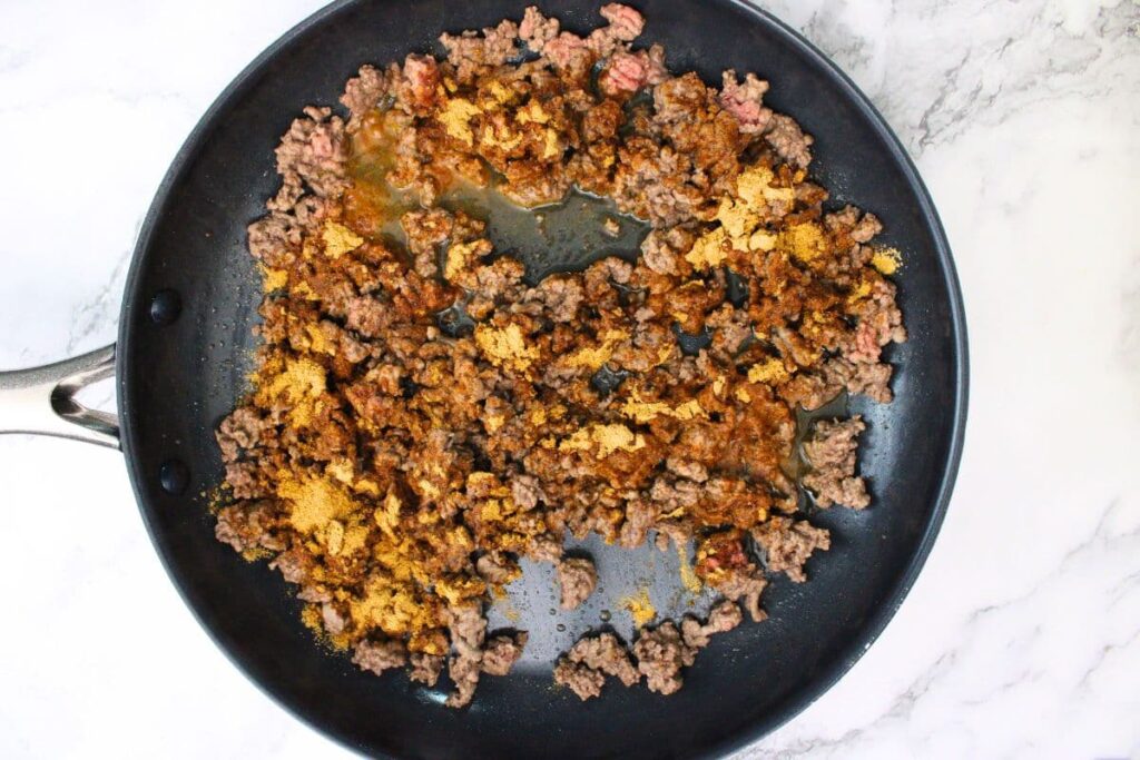 add taco seasoning to the ground beef