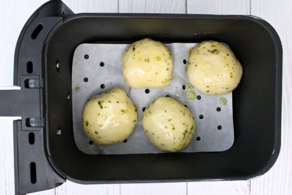 brush the tops of your pizza bombs with the garlic butter mixture