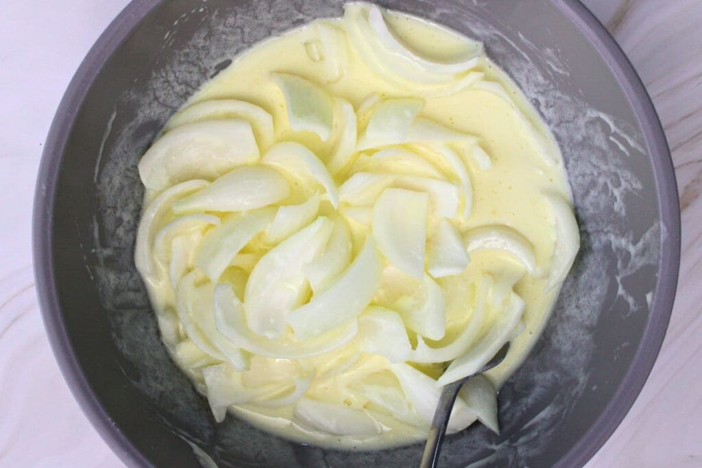 combine buttermilk and eggs then soak onions in mixture