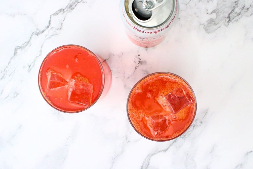 fill the glass with ice and top your blood orange mix with sparkling water