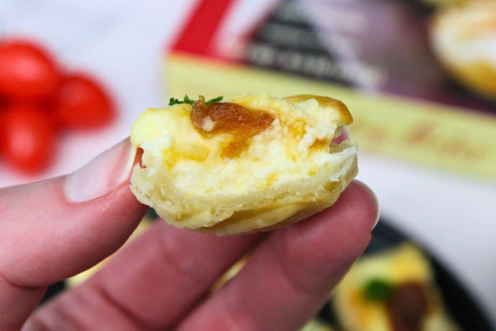 holding up a cross section of a trader joes pastry bite
