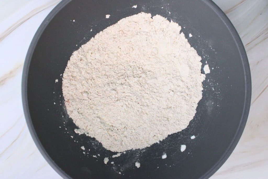 in a separate bowl combine cornstarch flour and seasonings