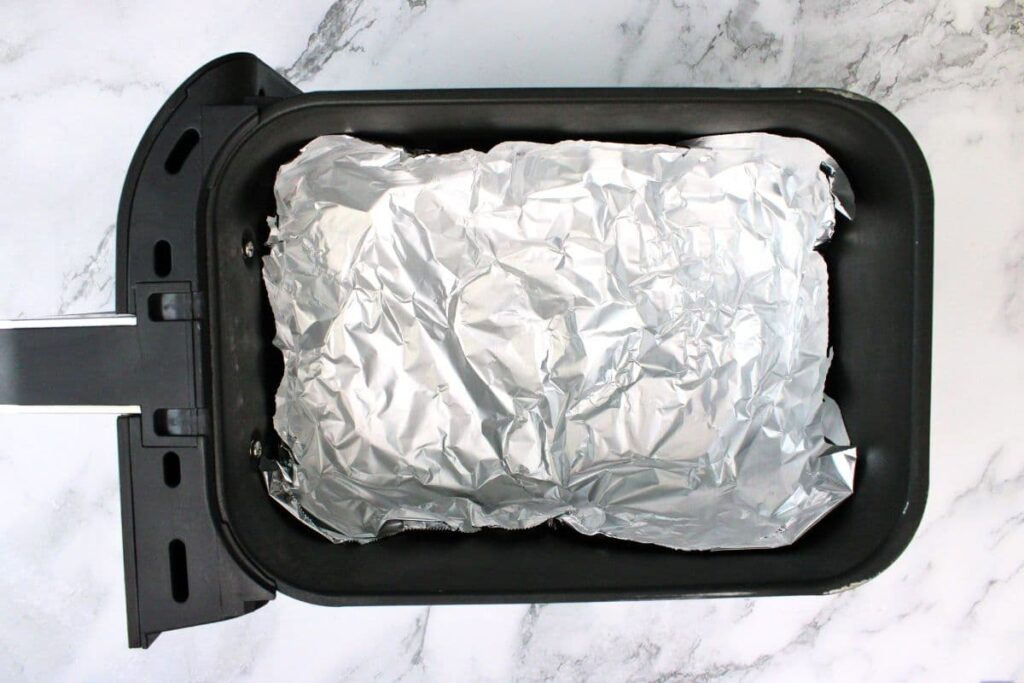 line air fryer basket with foil to create a bowl