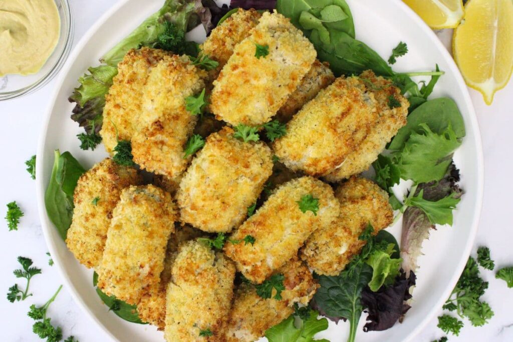 overhead view of air fryer chicken croquettes stacked on a plate