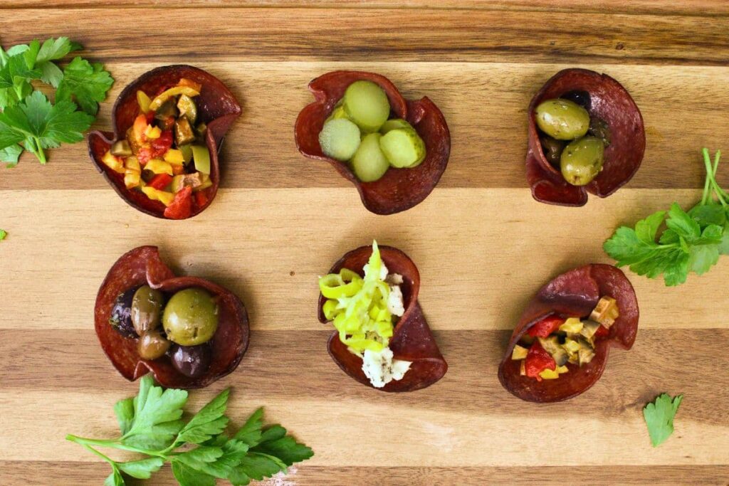 overhead view of various air fryer salami cups filled with antipasti