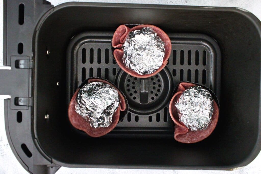 place salami cups in air fryer basket