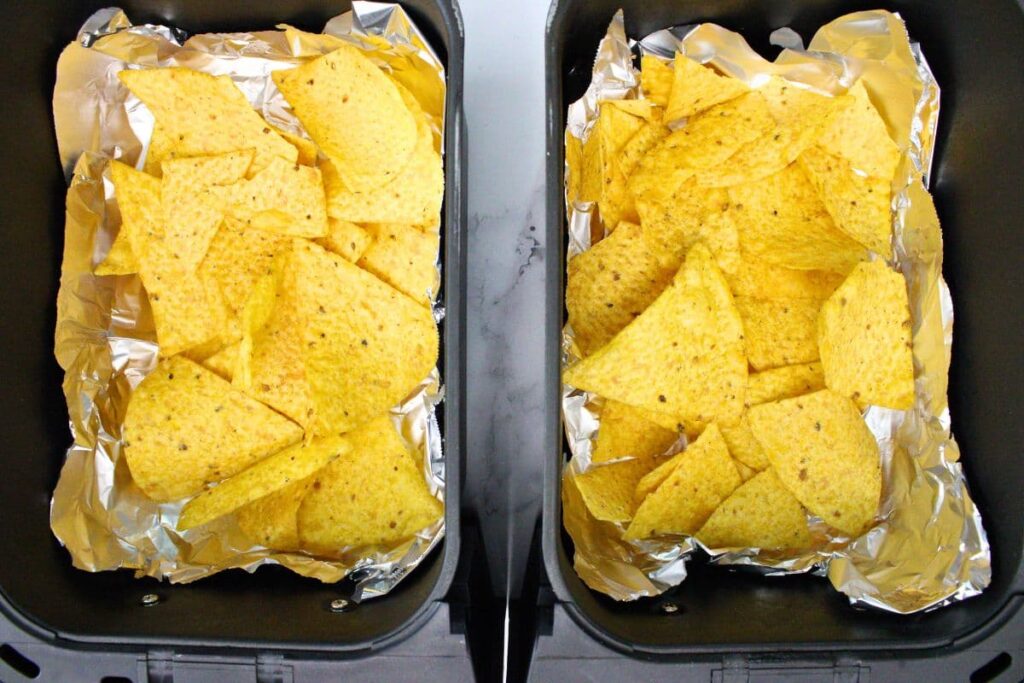 spread half tortilla chips across air fryer basket