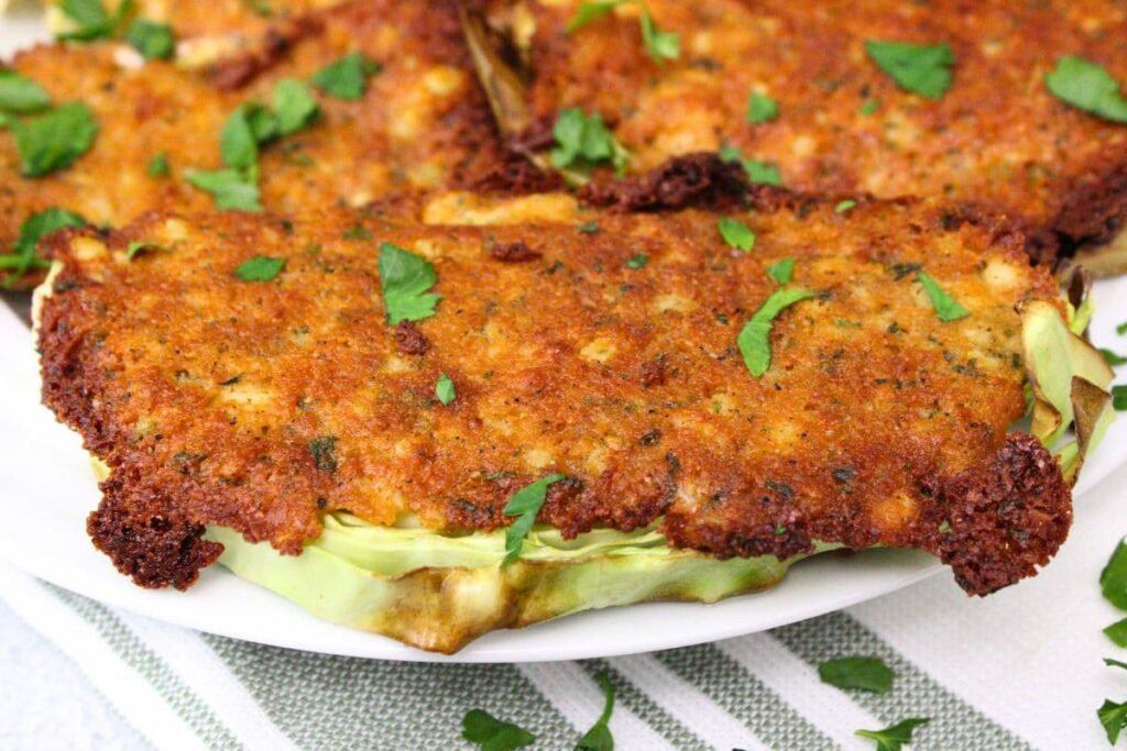 close up view of golden brown top of parmesan crusted cabbage