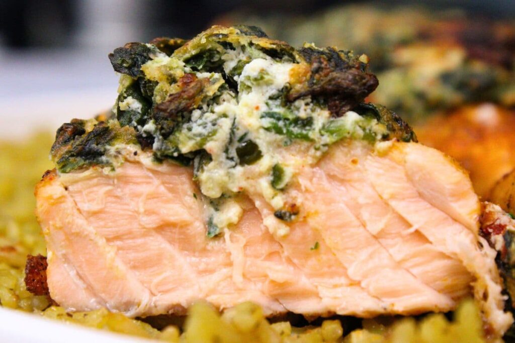 looking at a slice of air fryer spinach stuffed salmon