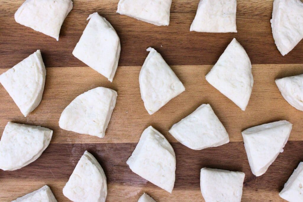 open your biscuit dough and cut them into quarters