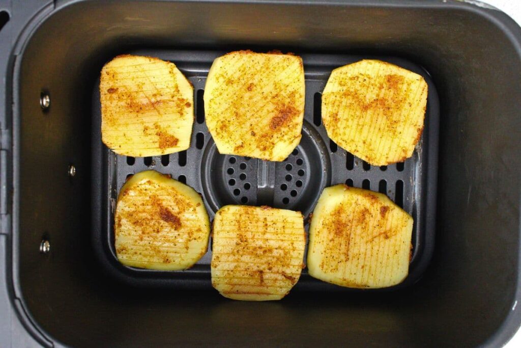 place accordion potatoes in air fryer basket