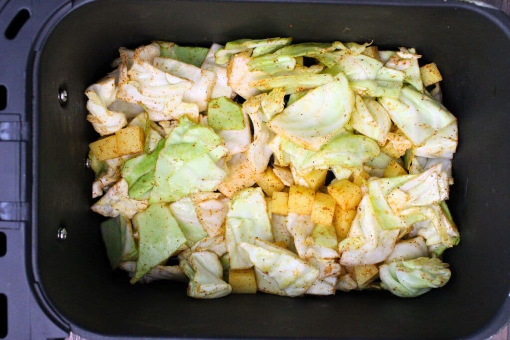 place the cabbage and potato mix in your air fryer basket