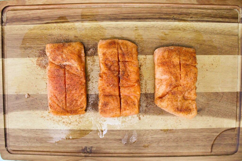rub salmon with olive oil and then season it