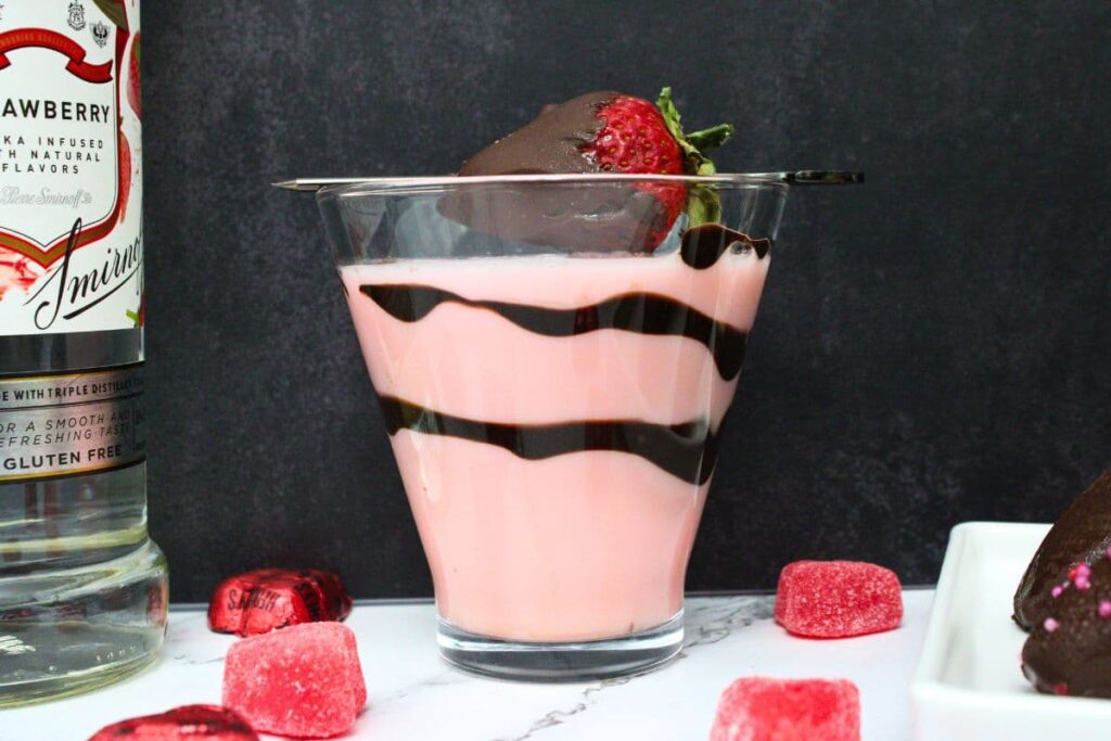 side view of chocolate covered strawberry martini with chocolate swirls