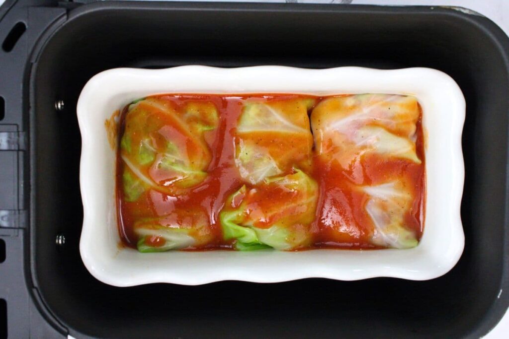 add cabbage rolls in pan to air fryer basket