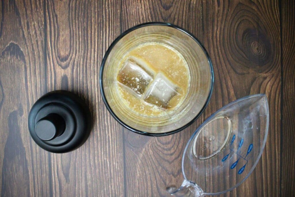 add long island iced coffee ingredients to cocktail shaker with ice