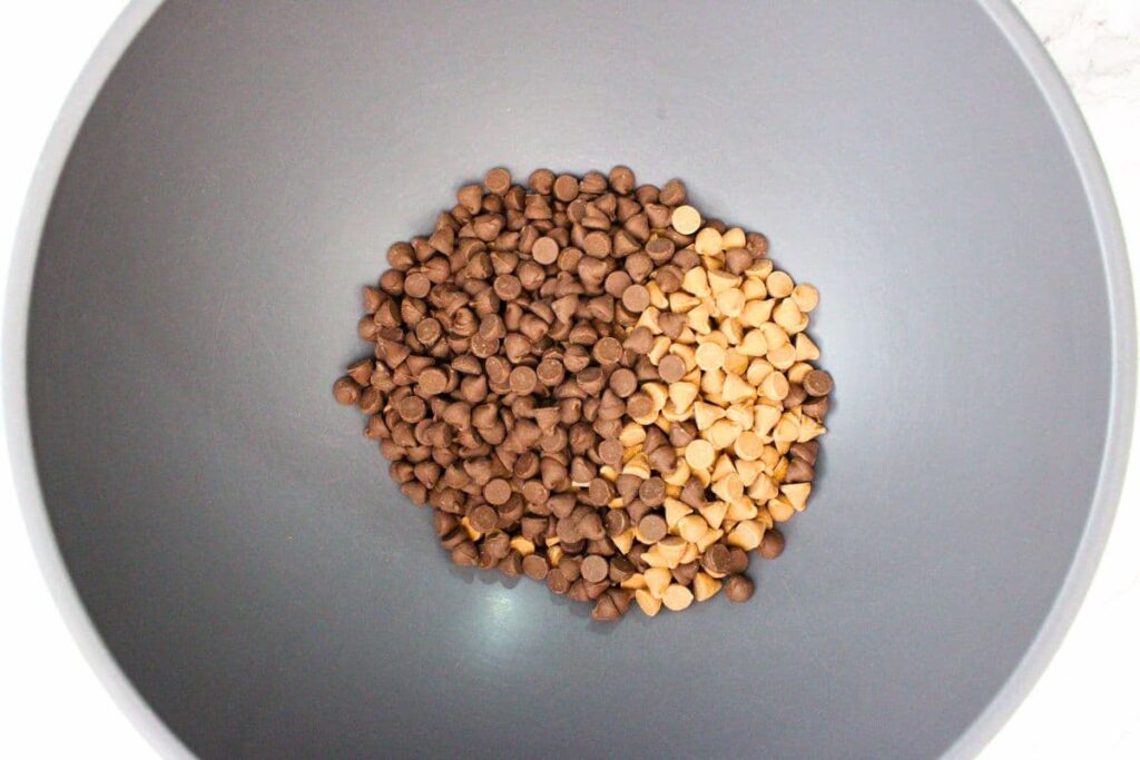 add milk chocolate and butterscotch chips to a microwave safe bowl