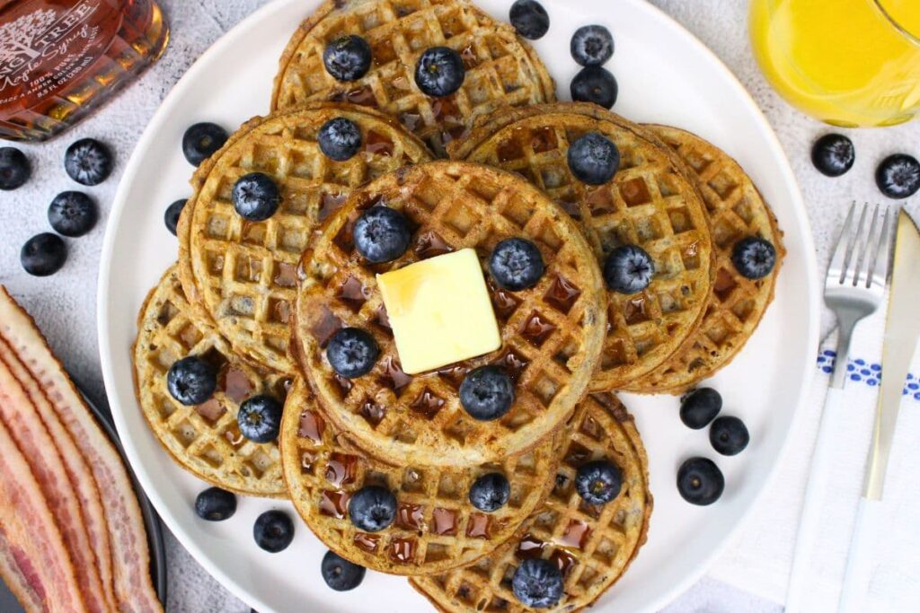 overhead view of air fryer trader joes blueberry waffles stacked on a plate