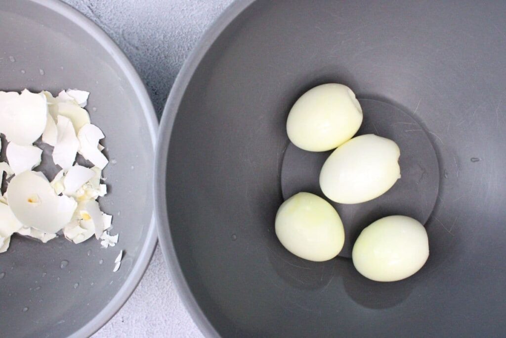 peel hard boiled eggs from the air fryer and separate the shells