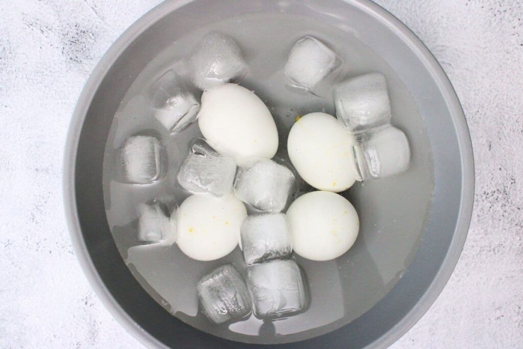 remove the cooked eggs and place them in an ice bath to cool