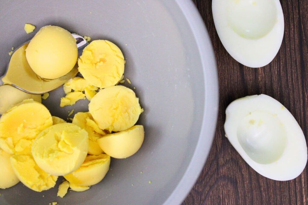 scoop out the egg yolks into a small bowl