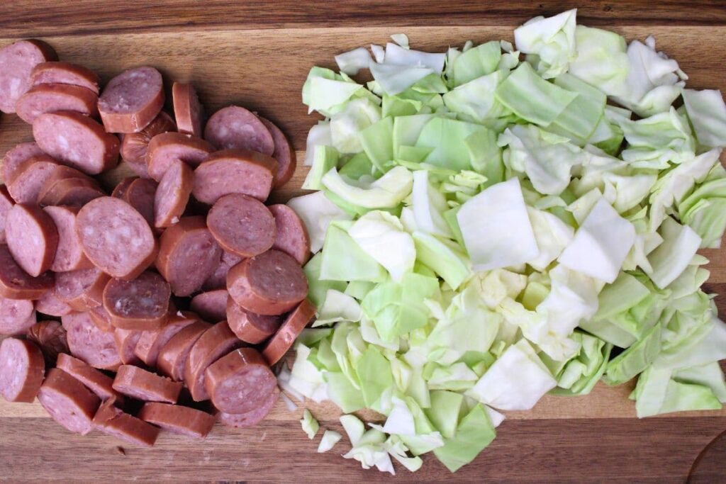 slice your sausage into links and chop the cabbage