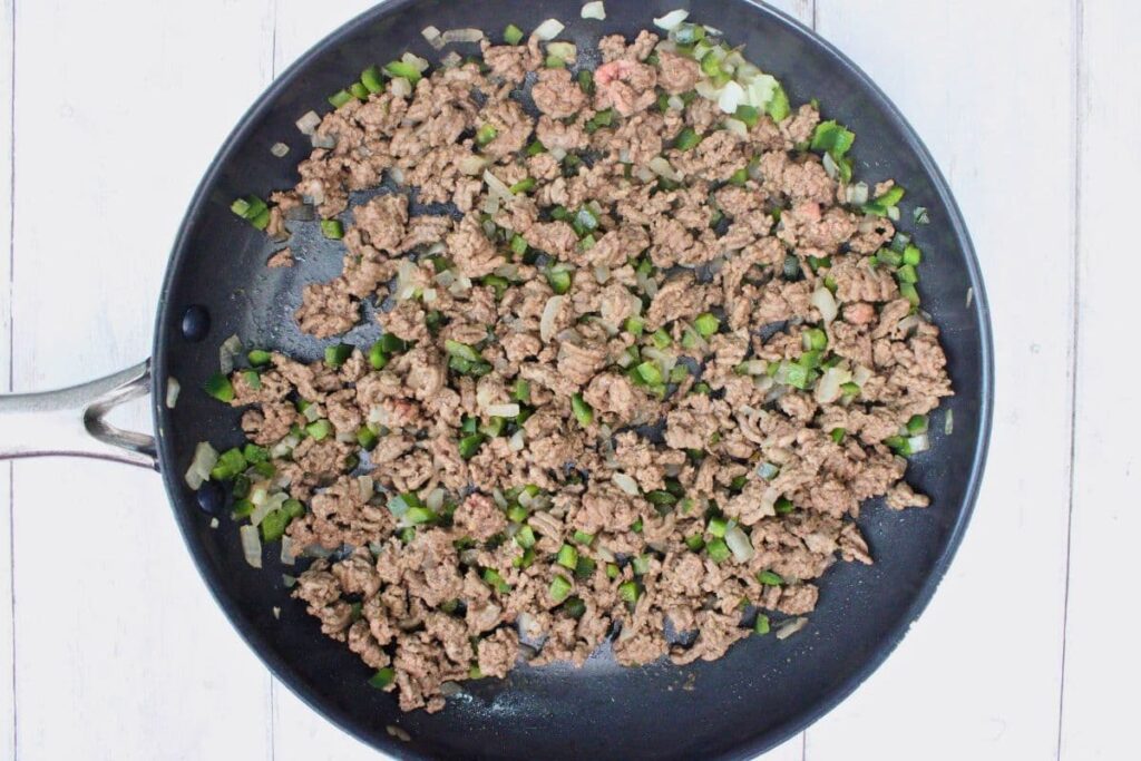 add ground beef to skillet and break it up as it cooks