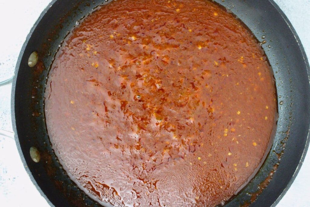 add in tomato paste, vinegar, salt, pepper, and red pepper flakes to finish and thicken bravas sauce