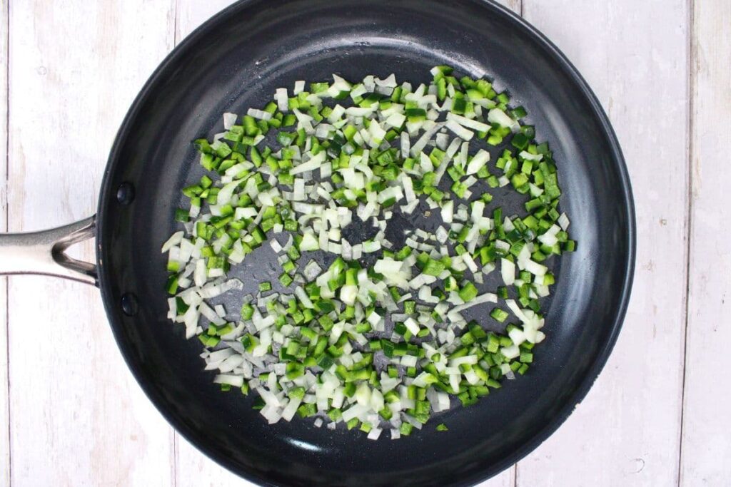 add oil and soften diced poblano and onion in a skillet