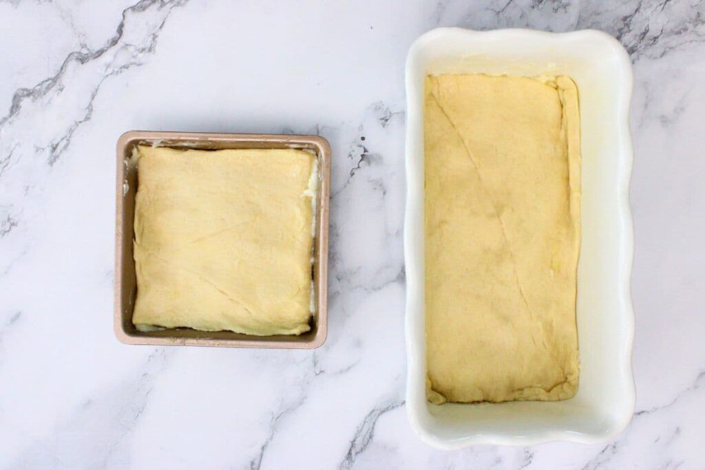 cover cream cheese mixture with second sheet of crescent dough