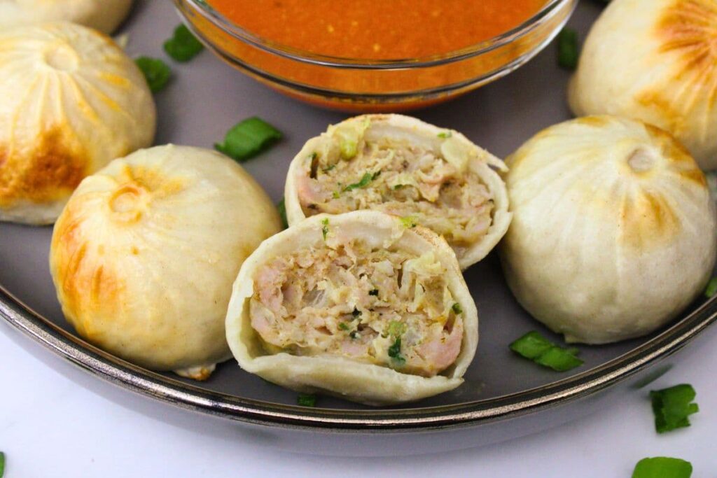 closeup view of an air fryer chicken momo cut in half