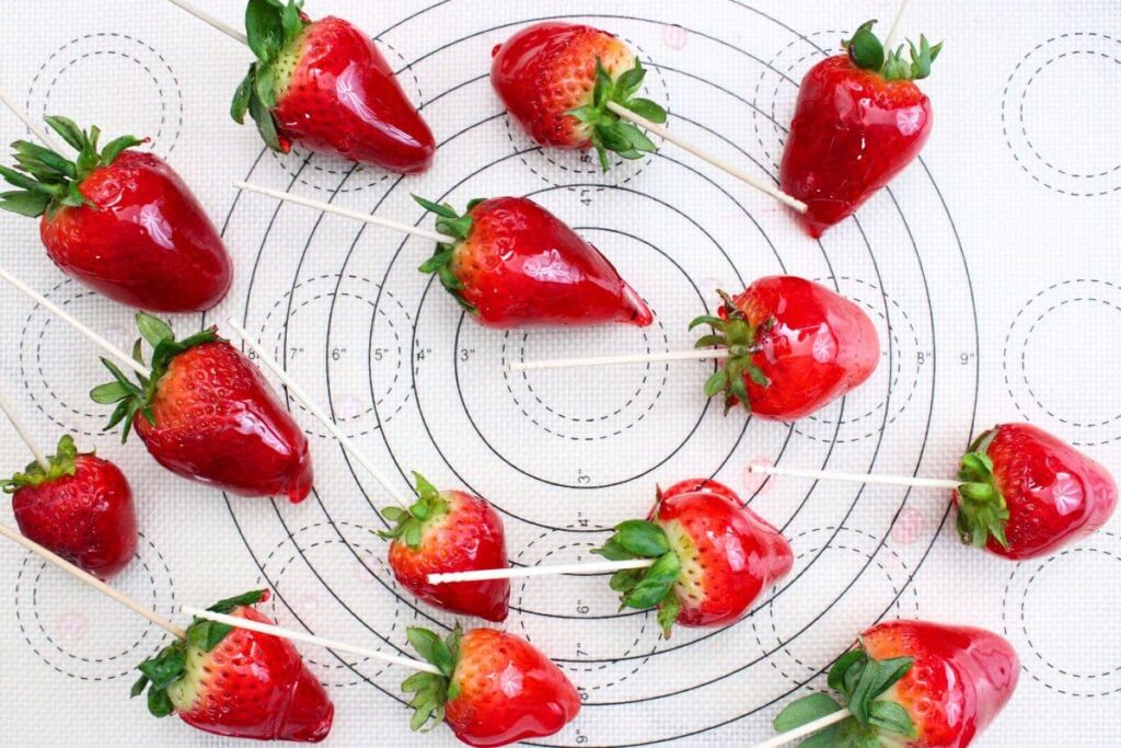 place dipped strawberries on a baking mat to harden
