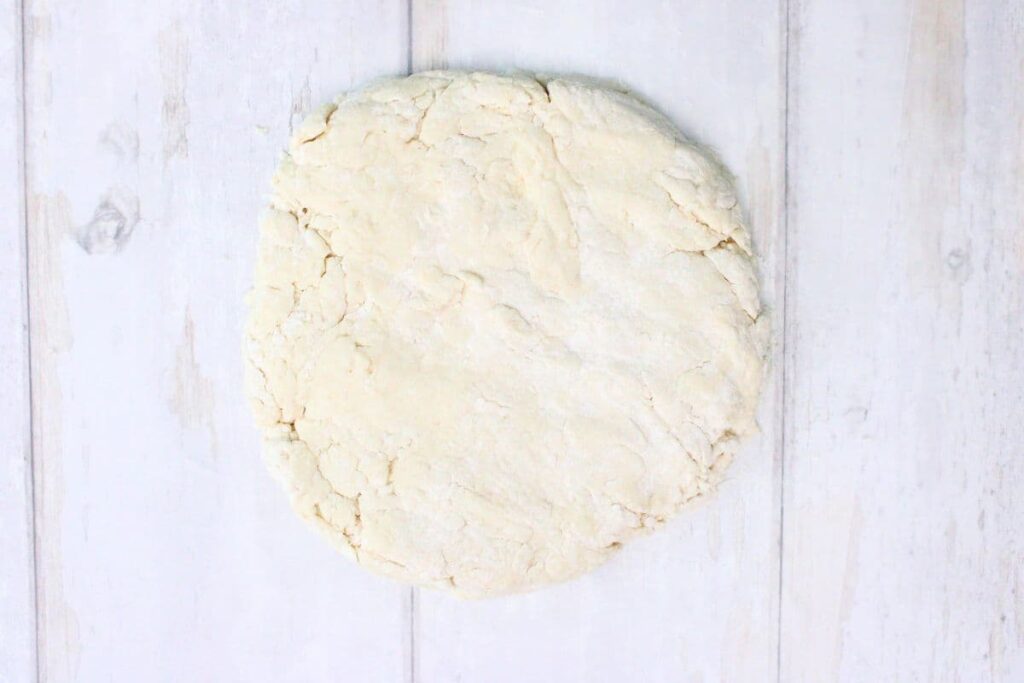 place dough on a clean work surface and pat into a circle