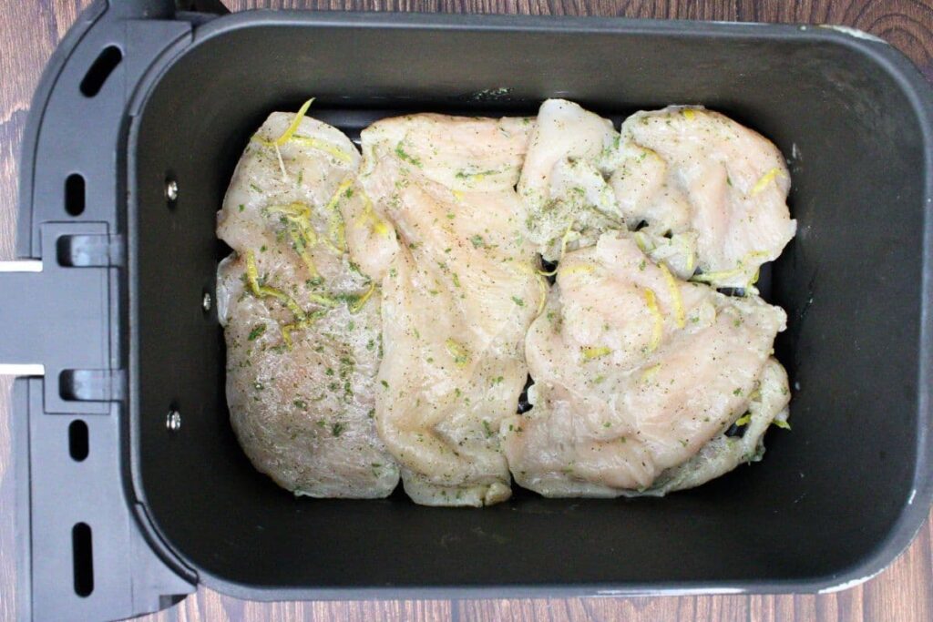 place lemon chicken breasts in air fryer basket