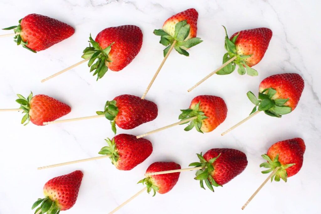 skewer each strawberry with a toothpick