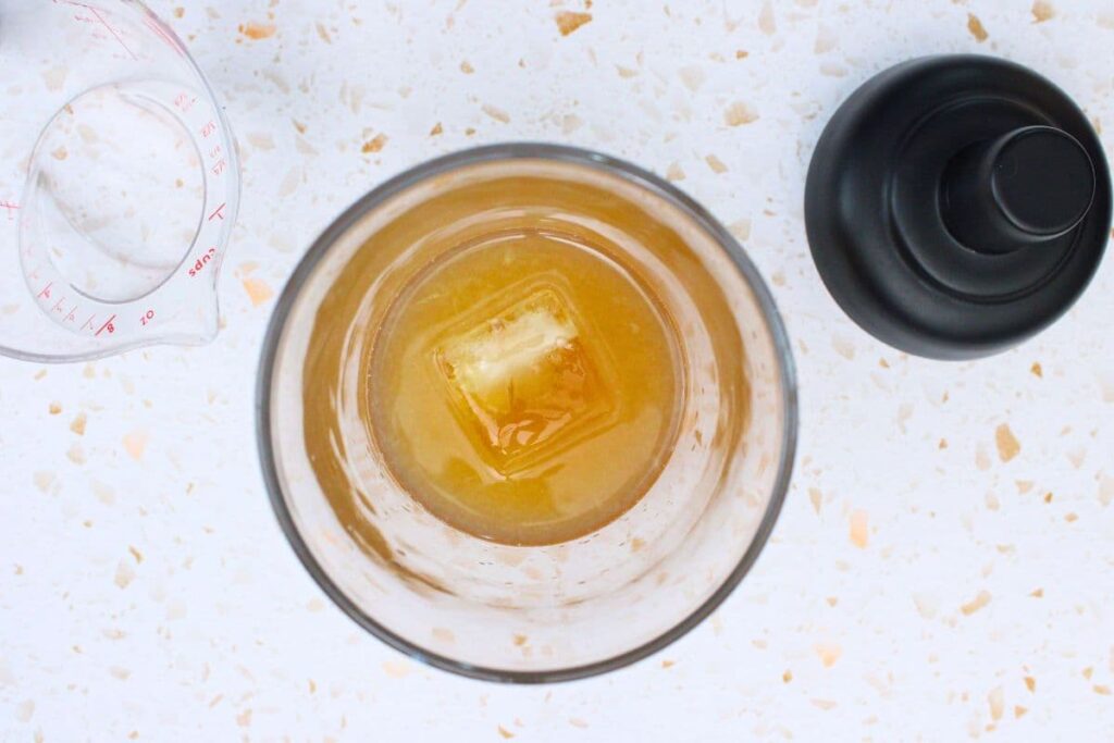 add all peach whiskey sour ingredients to cocktail shaker