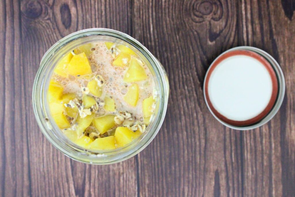 add peach overnight oats ingredients to mason jar