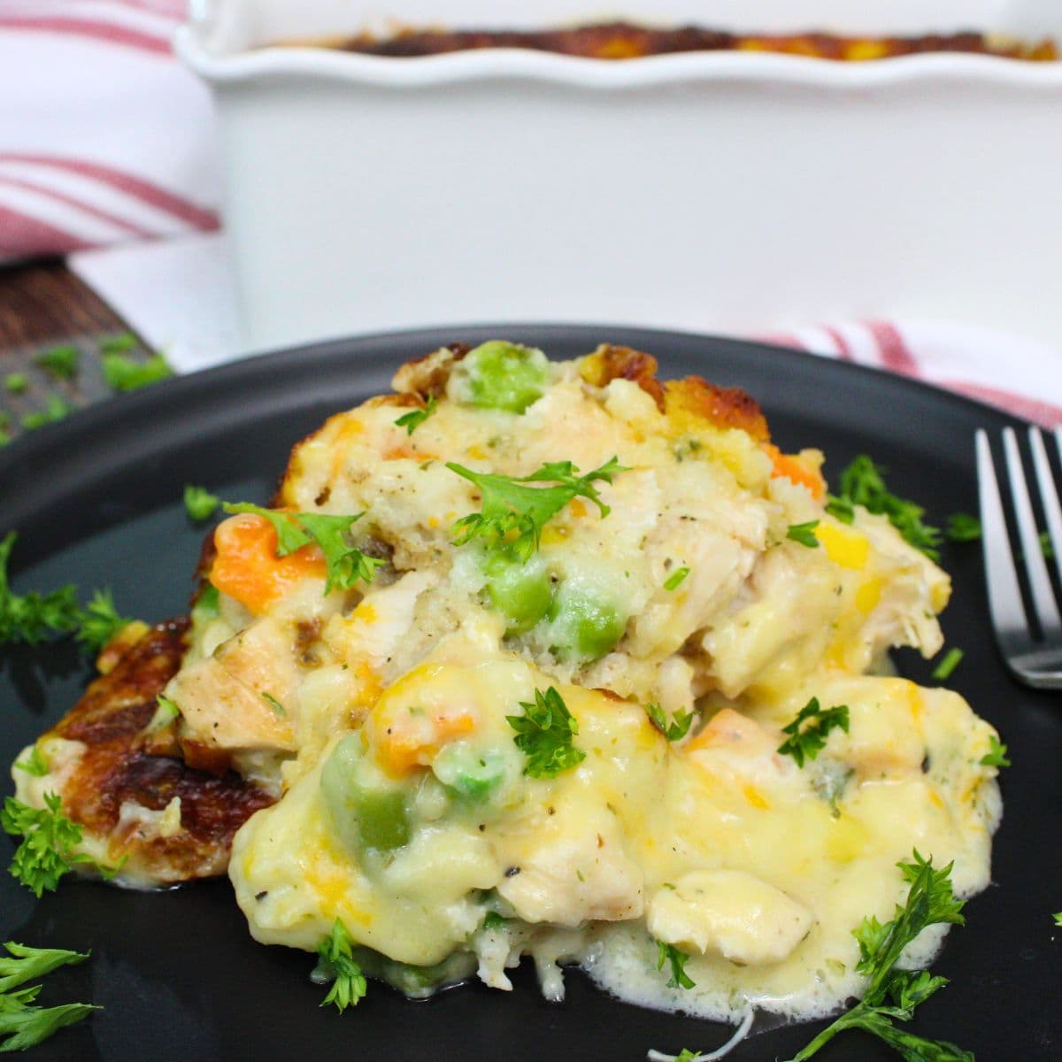 The Air Fryer Chicken Cobbler with Red Lobster Biscuits is a cozy, comforting dish that combines tender chicken, frozen vegetables, and a creamy chicken soup mixture topped with the famous Red Lobster Cheddar Bay Biscuits. The dish is assembled in layers, with no mixing needed, ensuring a rich and flavorful result with a fluffy biscuit topping. Ideal for a quick and hearty meal, it takes about 50 minutes to cook in the air fryer, resulting in a golden-brown, bubbly finish.