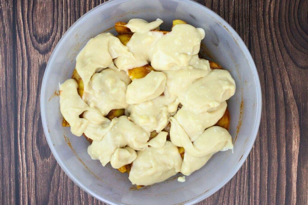 drop bisquick batter in drops on top of peaches