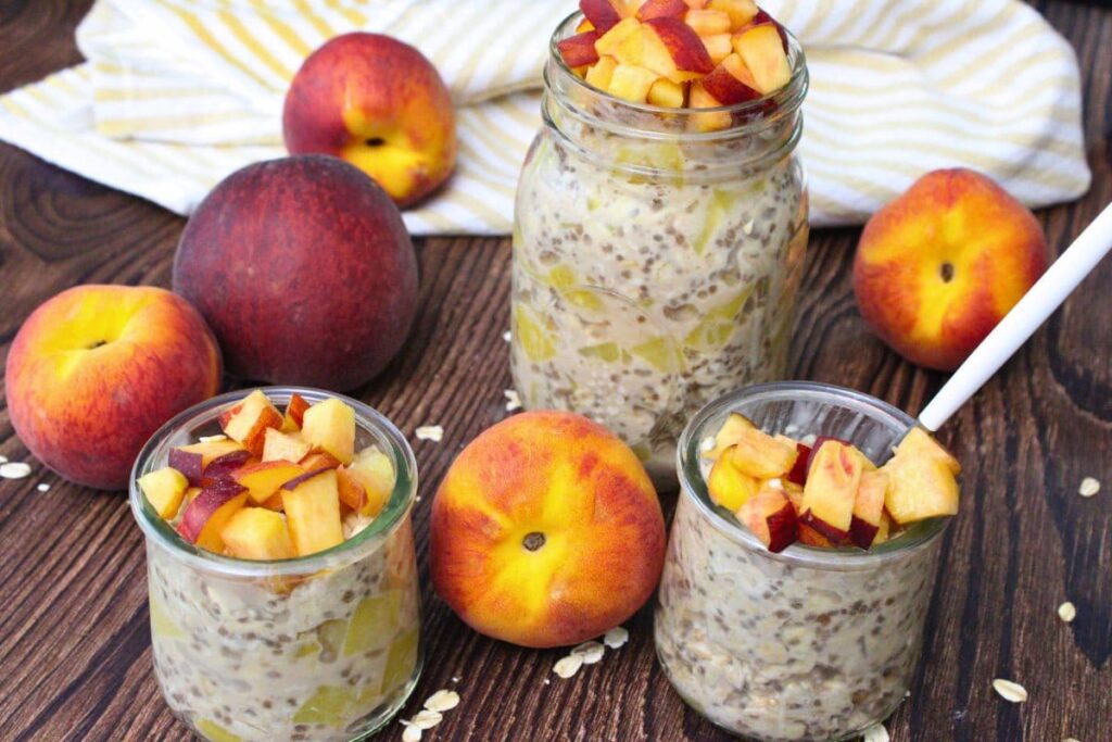 one large mason jar and to small ones filled with canned peach overnight oats