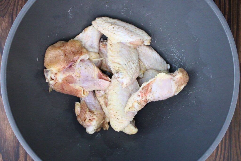 pat chicken wings dry then coat with oil and season