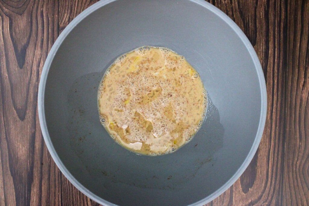 whisk eggs, brown sugar, milk, cinnamon, vanilla, crown peach whisky, and a pinch of salt