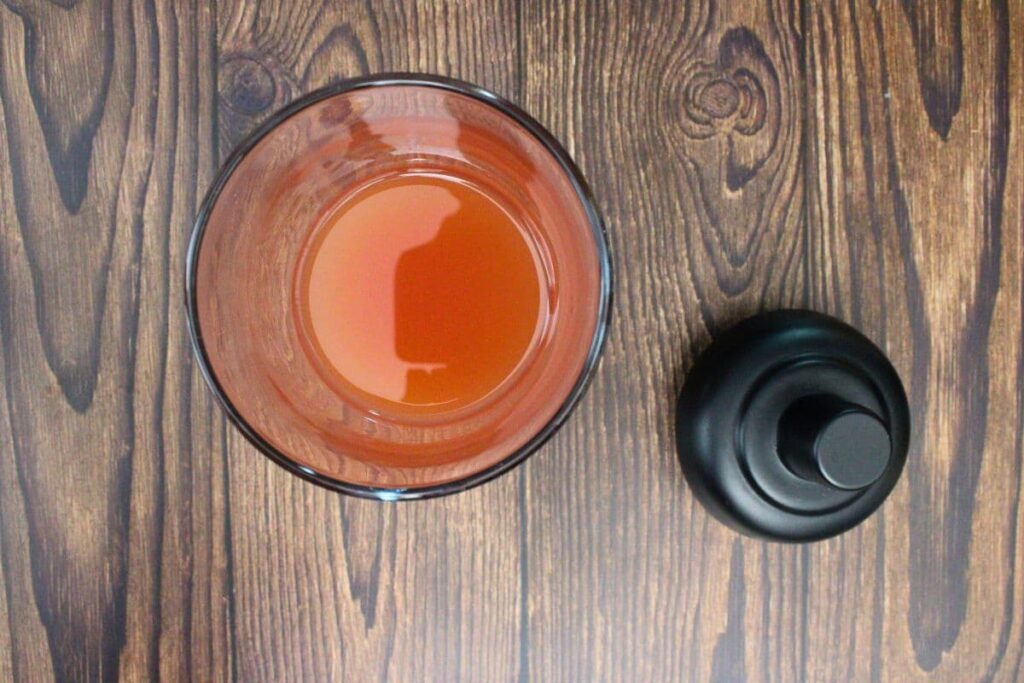 add peach fuzz ingredients to cocktail shaker