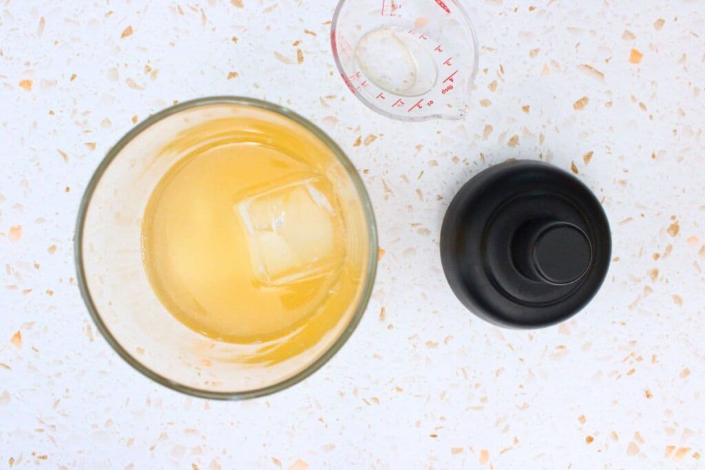 add peach lemon drop ingredients into cocktail shaker